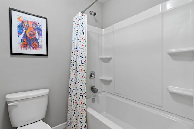 bathroom with toilet and shower / tub combo