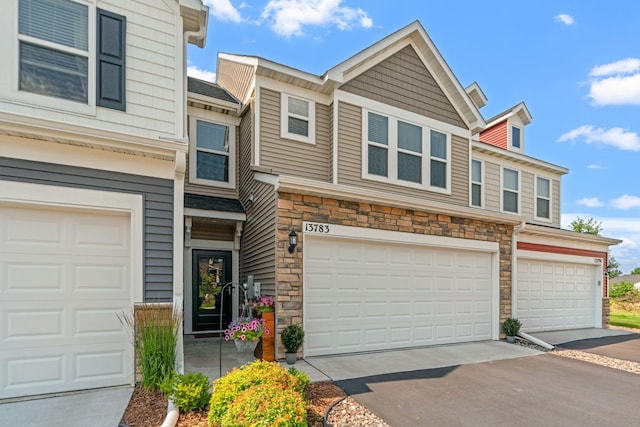 multi unit property featuring a garage