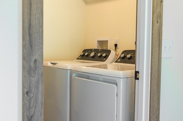 clothes washing area with laundry area and washing machine and dryer