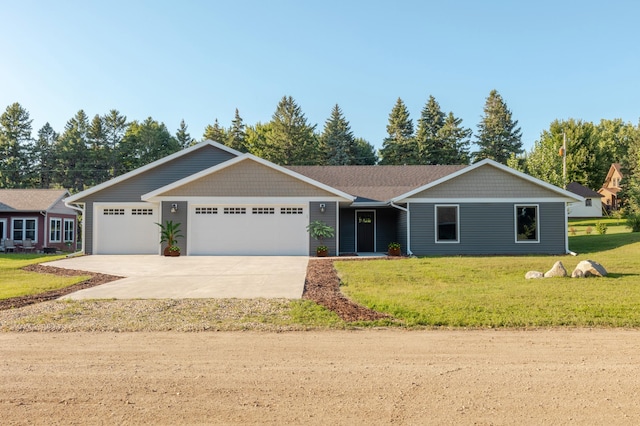 single story home featuring a garage, driveway, and a front yard