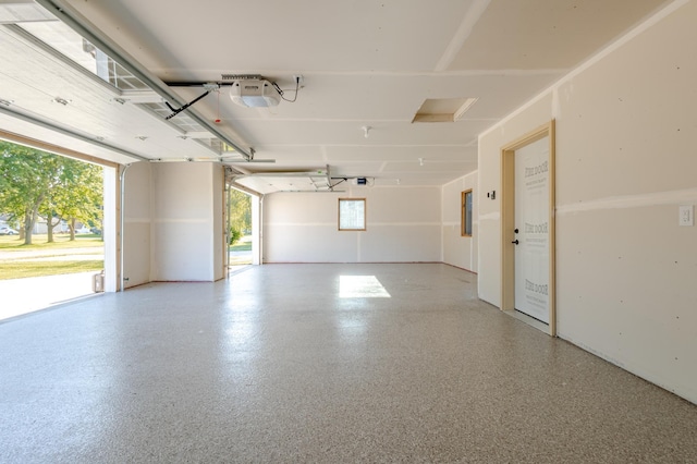 garage with electric panel and a garage door opener
