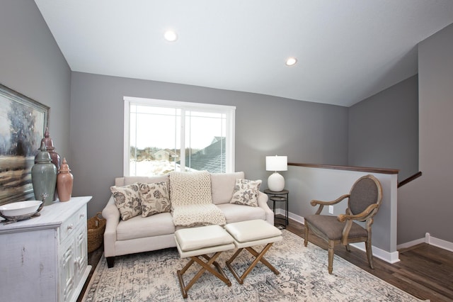 living room featuring hardwood / wood-style floors and vaulted ceiling