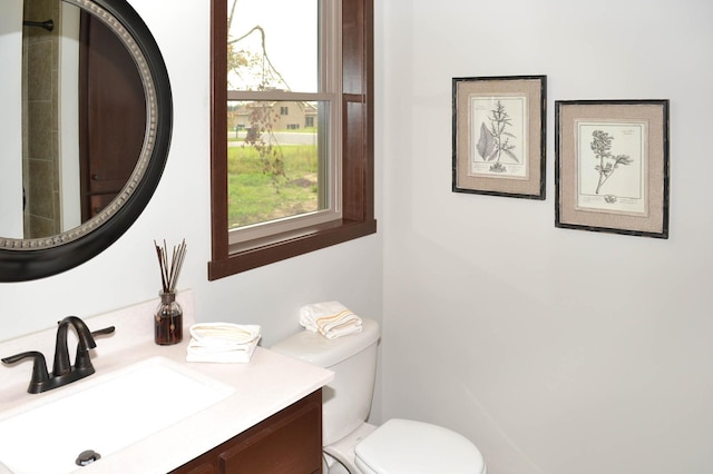 bathroom with vanity and toilet