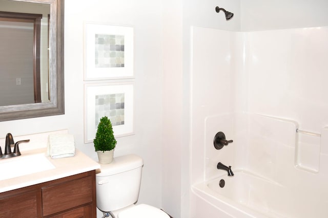 full bathroom featuring bathing tub / shower combination, vanity, and toilet