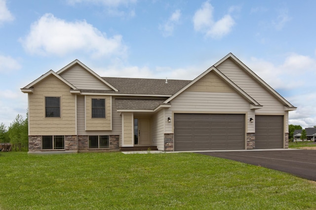 view of front of property with a garage and a front yard