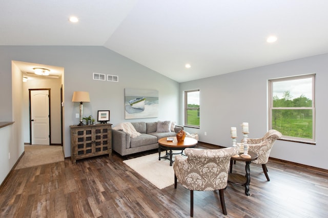 living room with wood-type flooring and vaulted ceiling