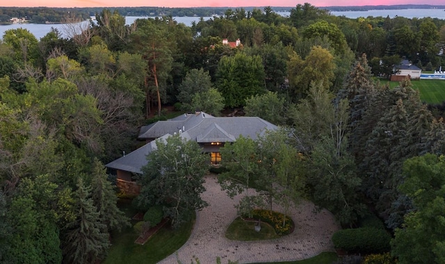 aerial view at dusk with a water view