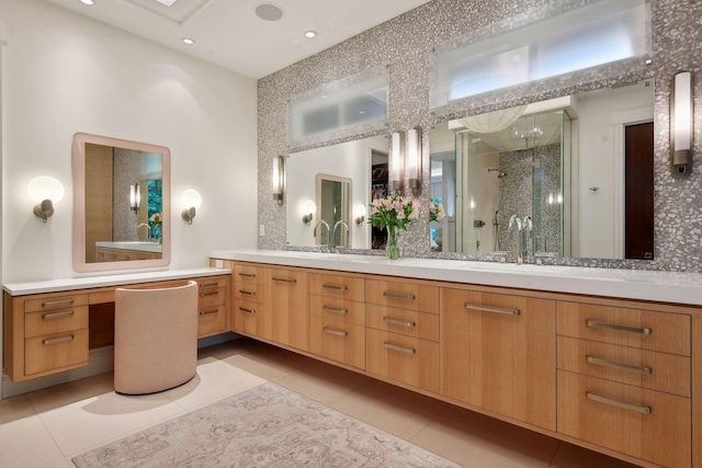 bathroom featuring vanity, a shower with shower door, and tile patterned flooring