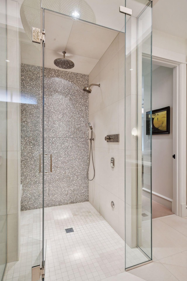 bathroom featuring tile patterned floors and an enclosed shower