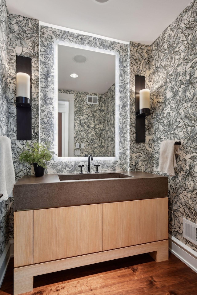 bathroom featuring vanity and hardwood / wood-style flooring