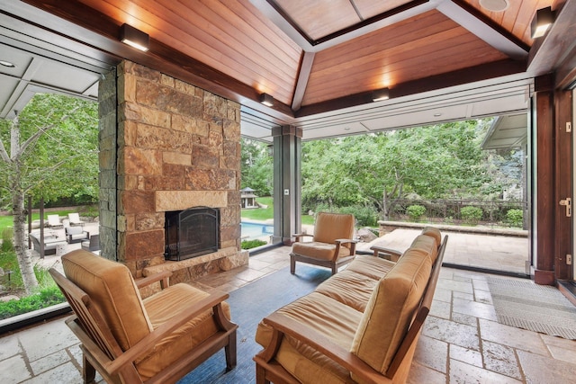 view of patio / terrace with an outdoor living space with a fireplace