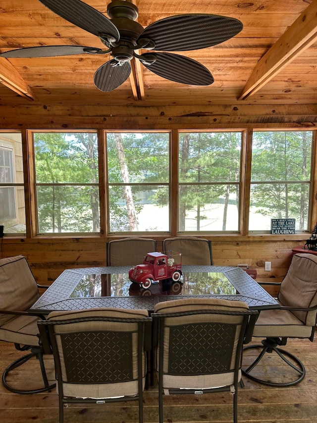 dining space featuring wood ceiling, lofted ceiling, hardwood / wood-style flooring, and ceiling fan