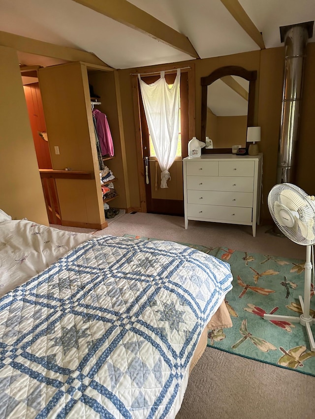 bedroom featuring light carpet, a closet, and vaulted ceiling