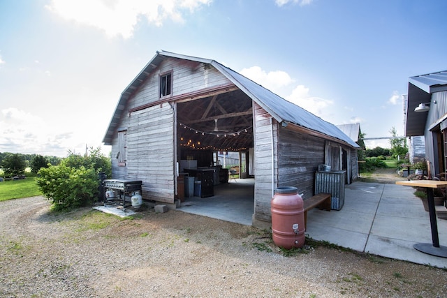 view of property exterior featuring an outdoor structure