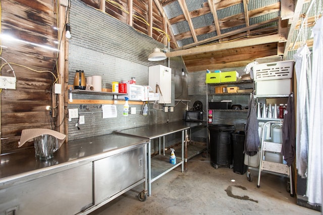 kitchen featuring white cabinetry and concrete floors