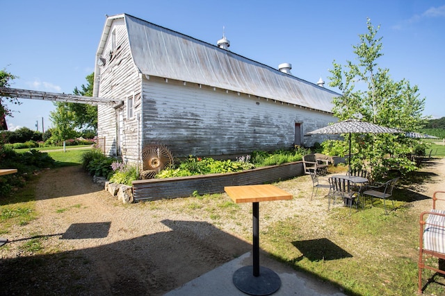 view of side of home featuring a yard