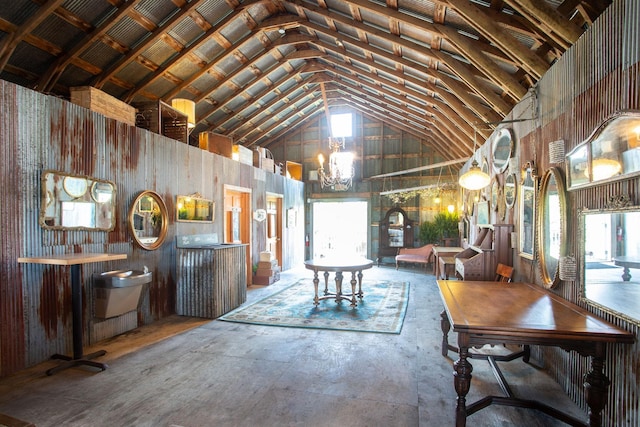 dining area with high vaulted ceiling