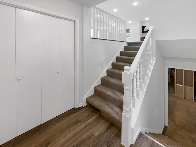 stairway featuring hardwood / wood-style flooring