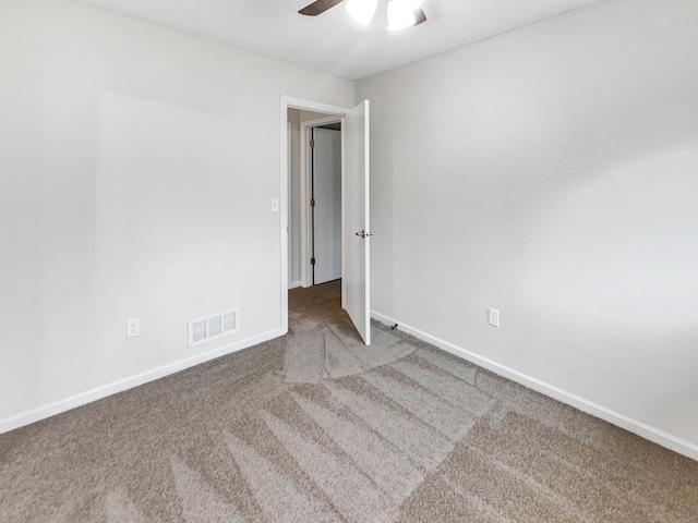 unfurnished room with ceiling fan and carpet floors