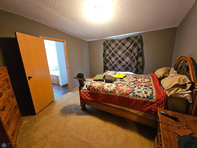 bedroom with carpet floors, a textured ceiling, and vaulted ceiling