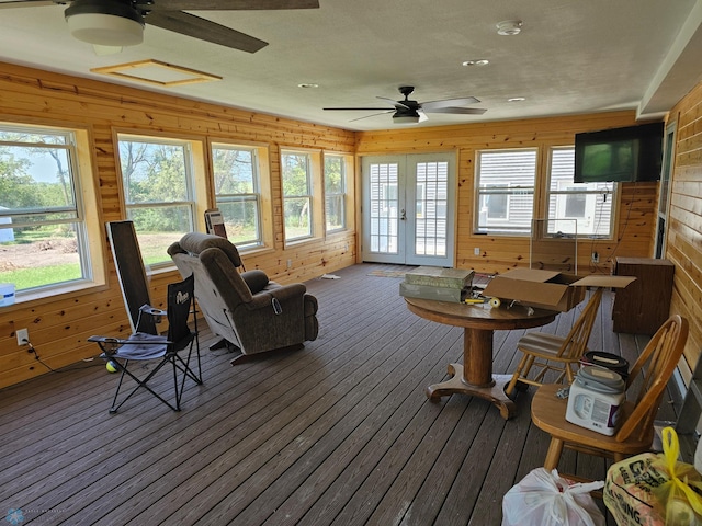 sunroom / solarium with ceiling fan and french doors