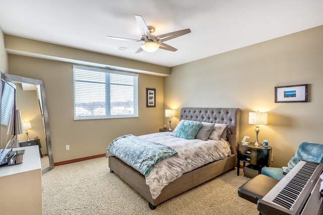 bedroom featuring light colored carpet and ceiling fan