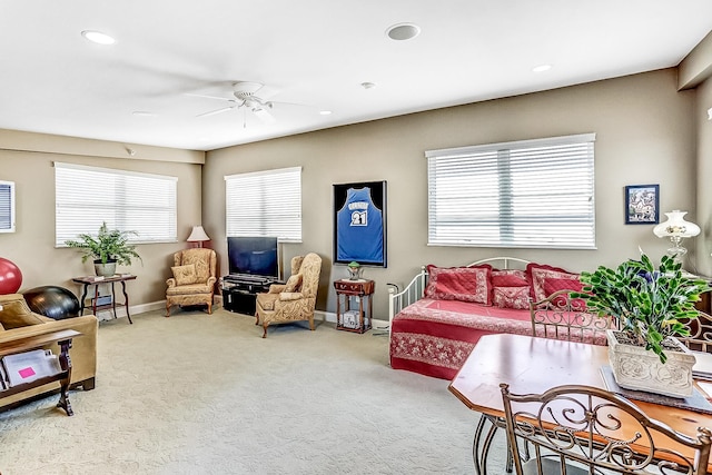 living room with carpet floors and ceiling fan