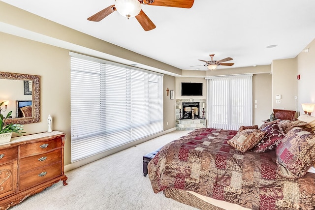 bedroom featuring light colored carpet and ceiling fan