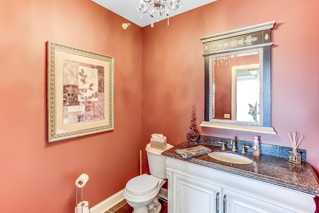 bathroom with vanity, tile patterned flooring, and toilet