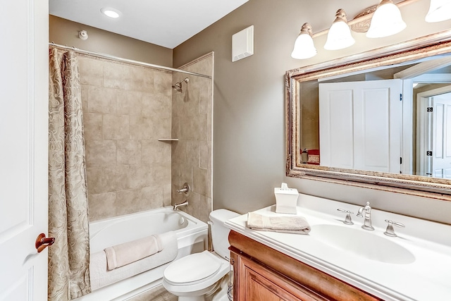 full bathroom featuring vanity, toilet, and shower / bathtub combination with curtain