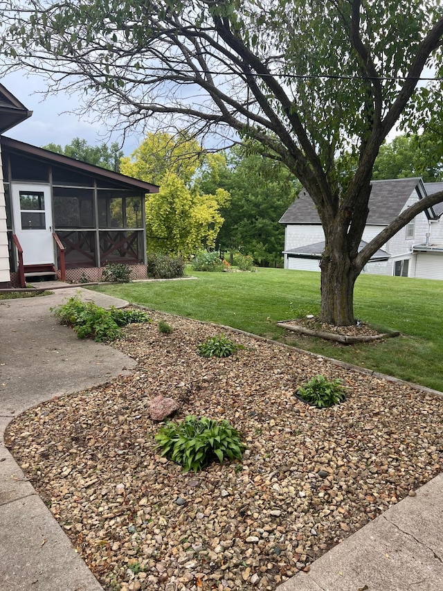 view of yard featuring a sunroom