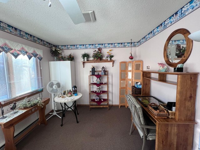 carpeted office space with a textured ceiling