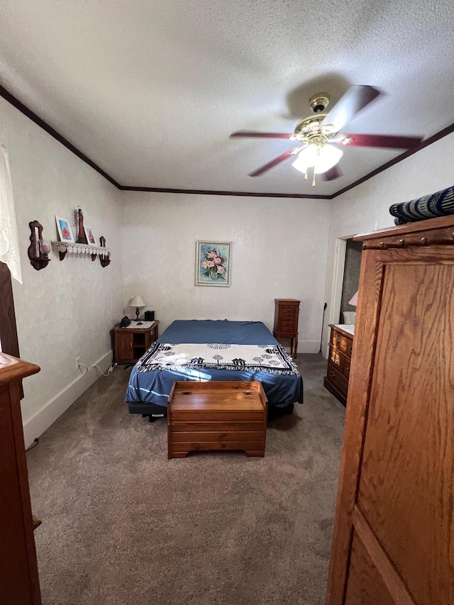 bedroom featuring ornamental molding, carpet, a textured ceiling, and ceiling fan