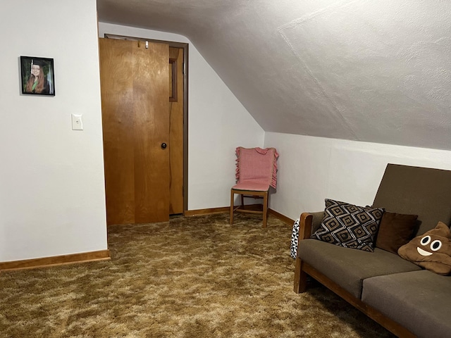 living area featuring baseboards, carpet flooring, and lofted ceiling