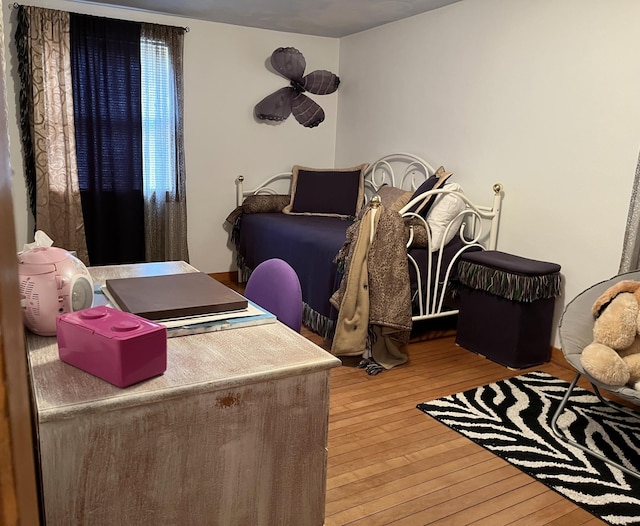 bedroom featuring hardwood / wood-style floors