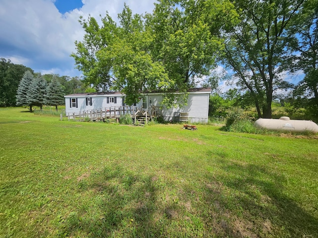 view of yard with a wooden deck