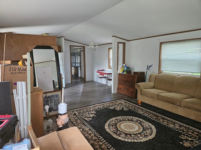 living room with lofted ceiling, crown molding, and dark hardwood / wood-style floors