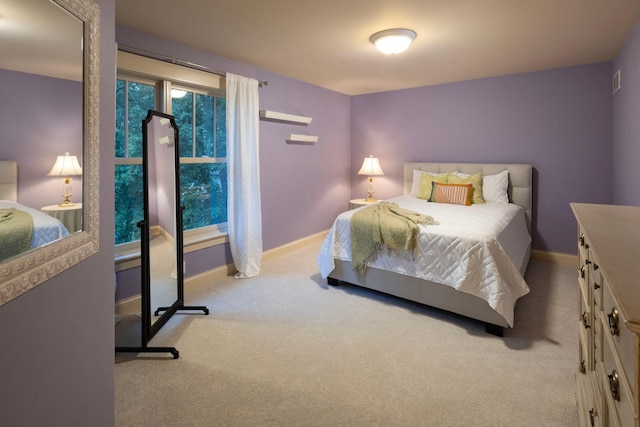 bedroom featuring carpet flooring and baseboards