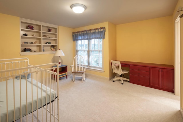 carpeted bedroom with baseboards