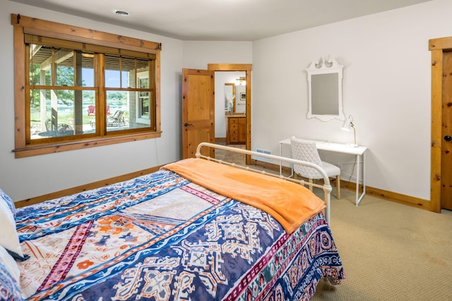 bedroom featuring carpet floors, visible vents, and baseboards