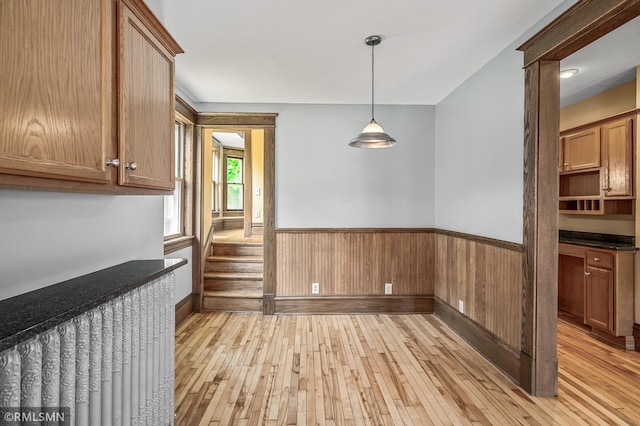 kitchen featuring light hardwood / wood-style flooring and pendant lighting