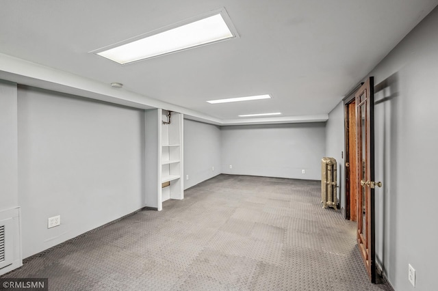 basement featuring carpet