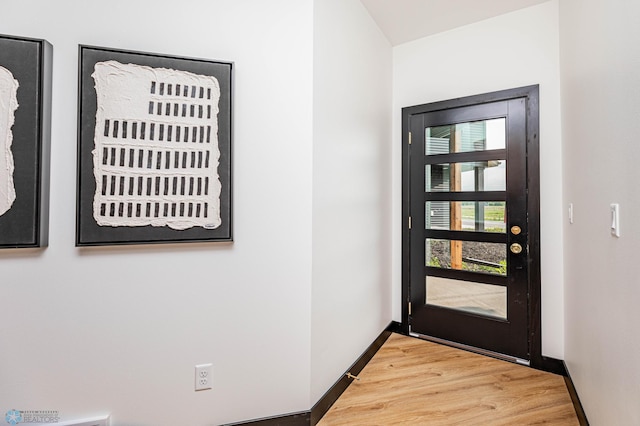 entryway with hardwood / wood-style flooring