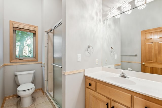 bathroom with vanity, toilet, an enclosed shower, and tile patterned flooring