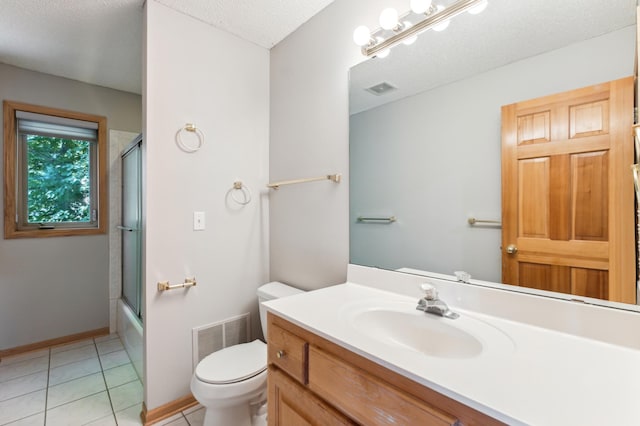 full bathroom featuring toilet, combined bath / shower with glass door, a textured ceiling, vanity, and tile patterned flooring