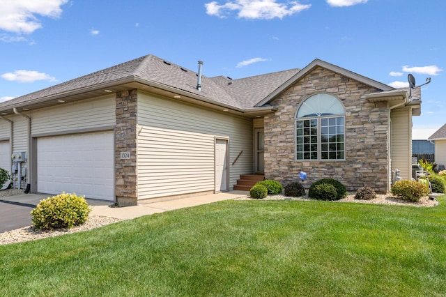 ranch-style home with a garage and a front lawn