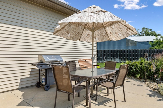 view of patio featuring a grill