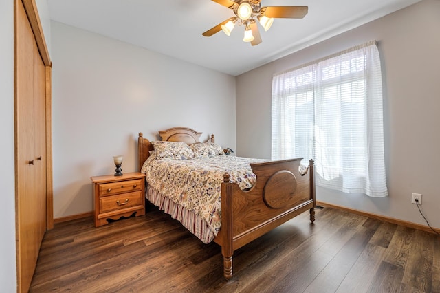 bedroom featuring a closet, ceiling fan, and dark hardwood / wood-style floors