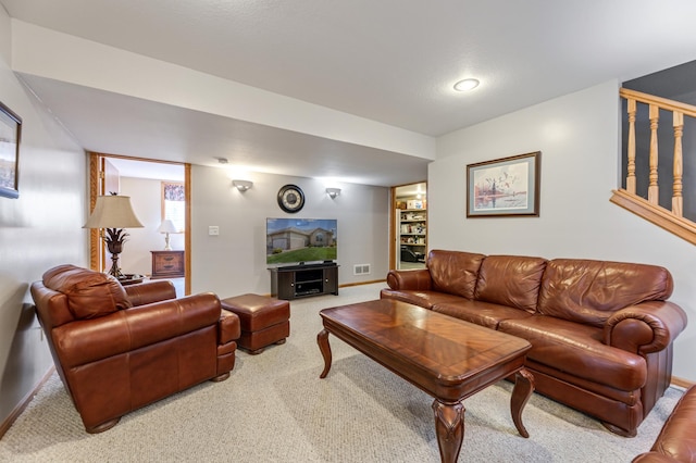 carpeted living room featuring built in features