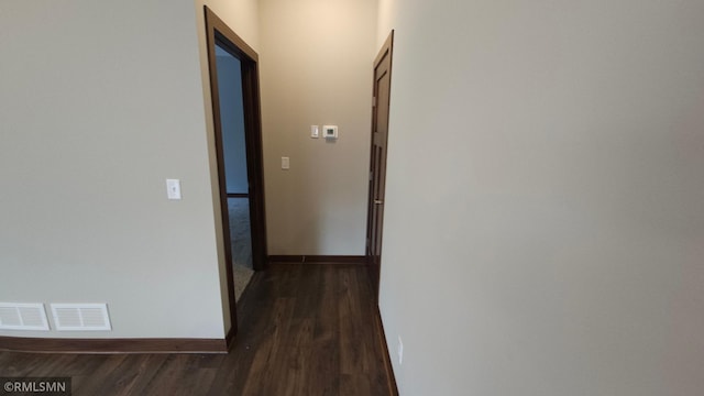 hallway featuring dark wood-type flooring